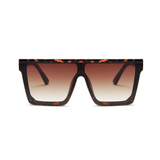 Front view of leopard, square block sunglasses, with brown gradient lenses.