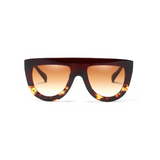 Front view of black and leopard, flat top oversized sunglasses, with brown tinted lenses.