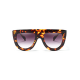 Front view of leopard, flat top oversized sunglasses, with black gradient lenses.