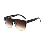 Side view of black and clear, square sunglasses, with black gradient lenses.