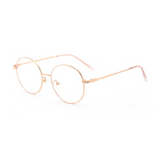 Side view of rose gold, circle blue light blocking glasses.