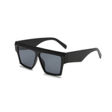Side view of black, square sunglasses, with dark lenses.