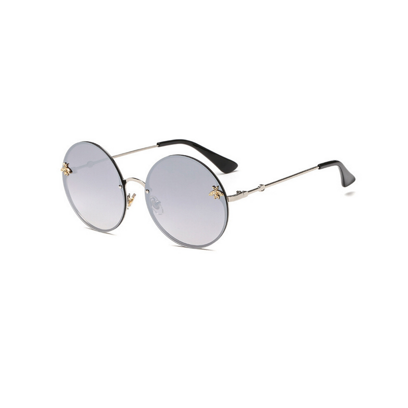 Side view of silver, large circle sunglasses, with mirror lenses and bee detail on the lenses.