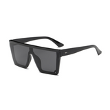 Side view of black, square block sunglasses, with dark lenses.