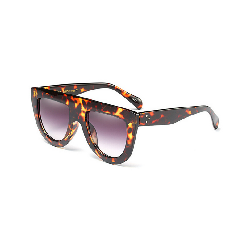 Side view of leopard, flat top oversized sunglasses, with black gradient lenses.